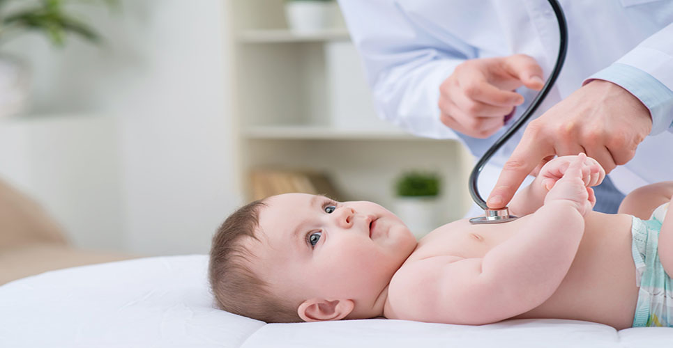 So beautiful world. Professional pediatrician holding stethoscope and examining infant  while being enticed in work